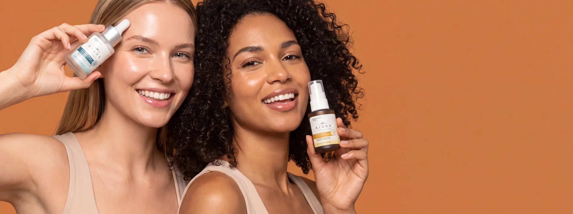 Two models holding Aruna Natural serum bottles